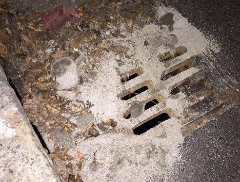 Sand, dirt and leaves collected on stormwater inlet